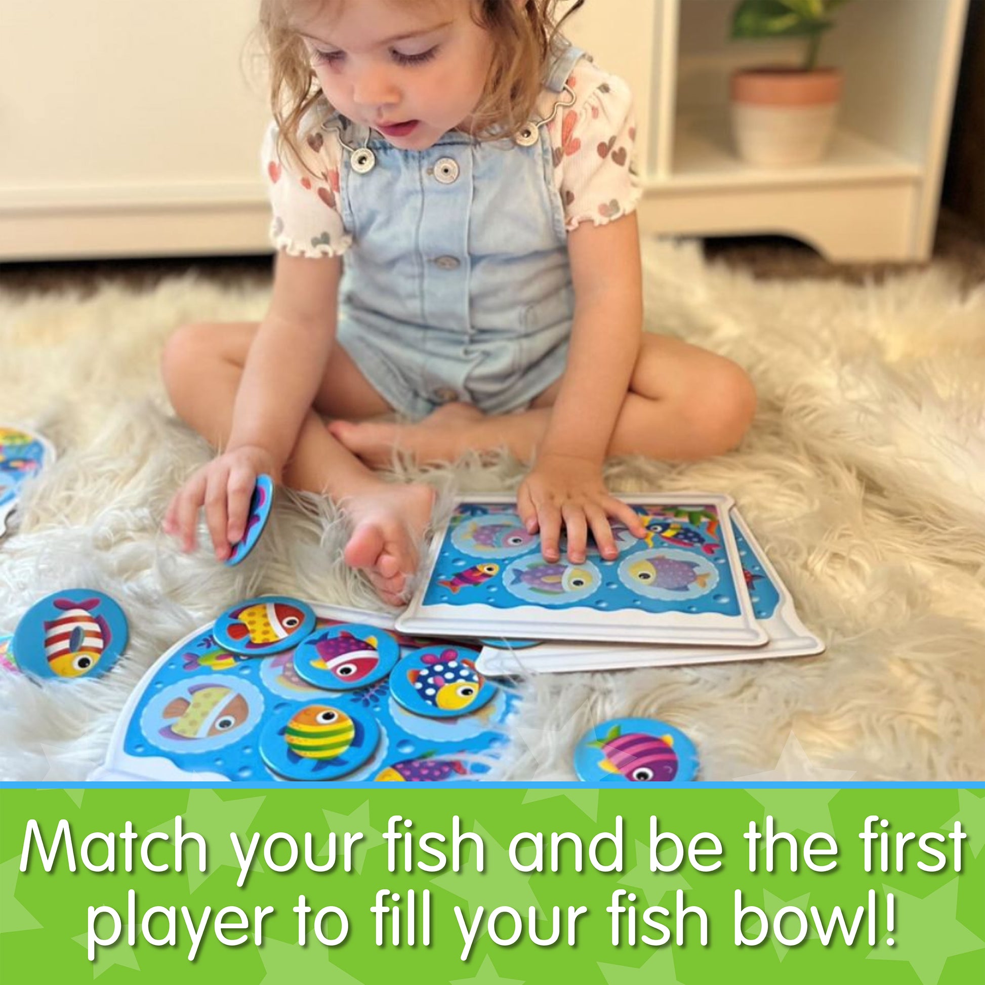 Infographic with little girl playing My First Play It - Match My Fish that says, "Match your fish and be the first player to fill your fish bowl!"