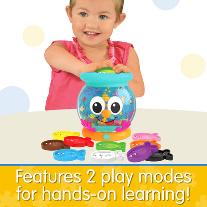 Infographic of little girl playing with Learn With Me Color Fun Fish Bowl that reads "Features 2 play modes for hands-on learning!"