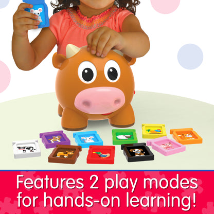 Infographic of little girl playing with Learn With Me Animal Farm Cow that reads, "Features 2 play modes for hands-on learning!"