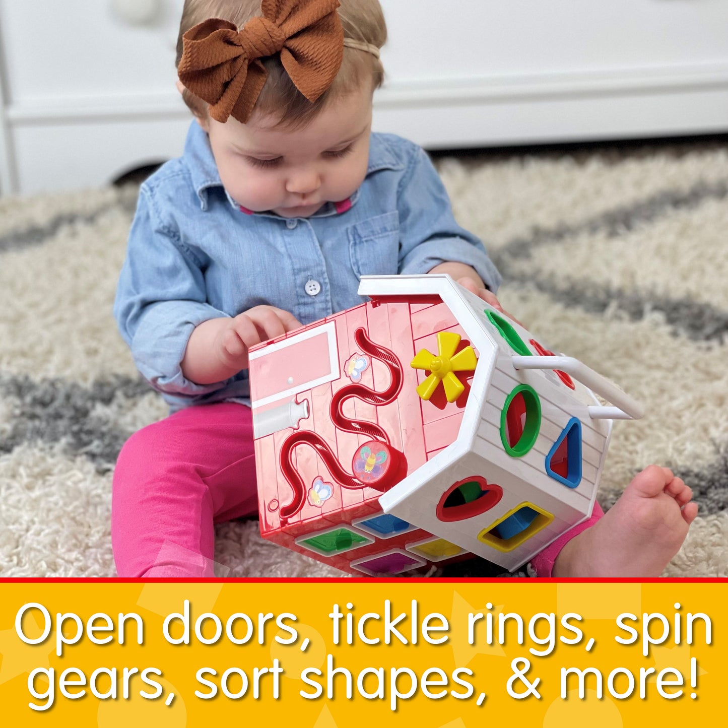 Infographic of baby girl playing with Farm Activity Cube that reads, "Open doors, tickle rings, spin gears, sort shapes, and more!"
