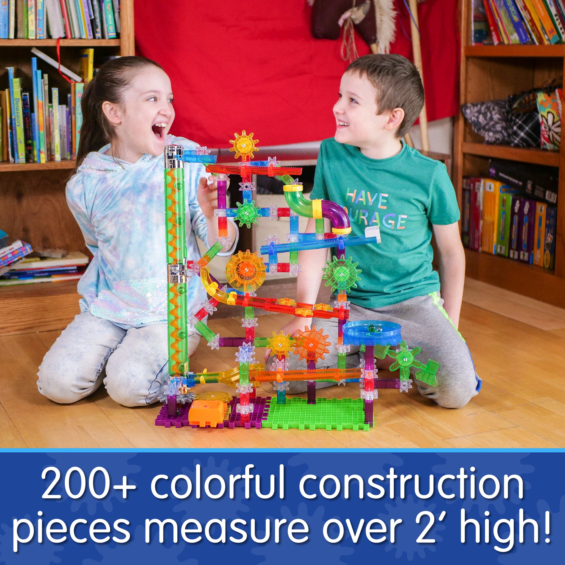 Infographic with two young kids playing with Extreme Glo that says, "200+ colorful construction pieces measure over 2' high!"