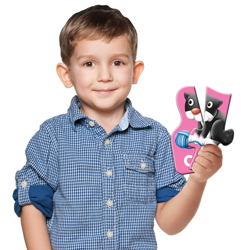 Young boy holding Match It - Spelling Jr