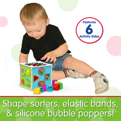 Infographic about Pop and Discover Activity Cube that says, "Shape sorters, elastic bands, and silicone bubble poppers!"
