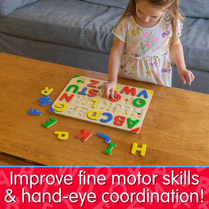 Infographic of young girl playing with Lift and Learn ABC Puzzle that reads, "Improve fine motor skills and hand-eye coordination!"